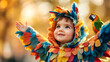 © Анна Терелюк - Kid in parrot costume outside. A joyful child wears a vibrant parrot costume while interacting with a small parrot in a sunny outdoor setting.