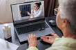 © Светлана Мищенко - Elderly woman having online consultation with doctor reviewing MRI scan of spine, discussing back pain treatment, healthy aging, cognitive support, omega 3, and biohacking. Telemedicine concept.