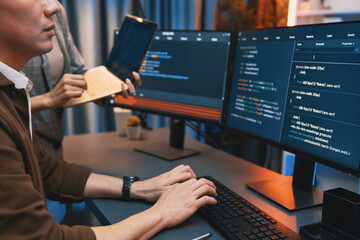 Serious of IT developers discussing intelligent website development coder system running data online two screens with laptop showing information network at neon light room at modern office. Infobahn.