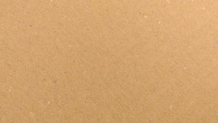 Background of brown kraft paper or cardboard texture. Abstract pattern of beige rough carton, old paper sheet, 
