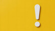 © BALOCH - Bold white exclamation mark emphasizes important message or alert on vibrant yellow background