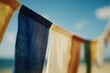 © Сергей Захаров - Colorful fabric banners sway gently in warm sunlight against clear blue sky