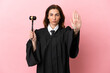 © luismolinero - Middle aged judge woman isolated on pink background making stop gesture