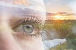 © Tunatura - Save planet, spirit and contact with nature concept. Double exposure of human eye with natural scenery on the background.