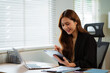 © NINENII - Businesswoman using tablet to do online checklist survey, doing assessment online survey answer test questions Digital form.
