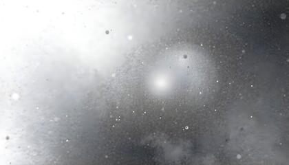 Abstract image showcasing a bright, central light source surrounded by textured, diffused shapes and particles.