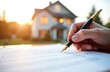 © miss irine - Person signs contract with fountain pen on paper in front of house during sunset. Hand holding pen writes on document. Blurred background of home and sun. Formal agreement.