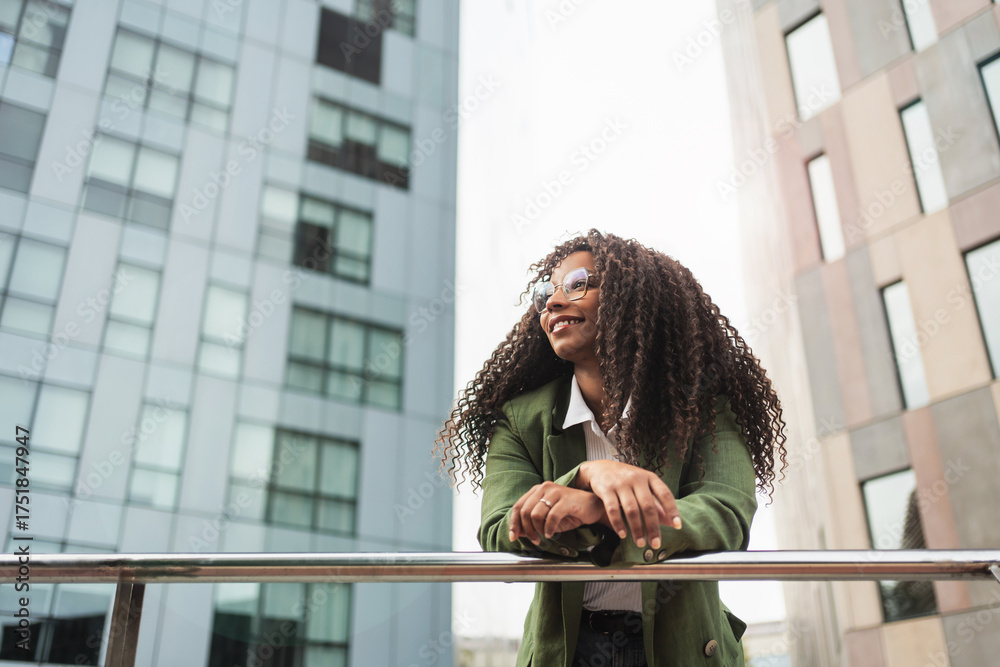 Young African American business woman in trendy outfit and glasses ...