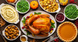 © Ashish - A delicious and abundant thanksgiving dinner spread with a roasted turkey, stuffing, mashed potatoes, green beans, cranberry sauce, and pumpkin pie