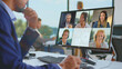 © Videophilia - Business professional engaging in a virtual video meeting with diverse colleagues on a desktop computer, collaborating and communicating remotely from an office environment