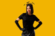 © Pixel-Shot - Beautiful young woman in bats headband dressed for Halloween on yellow background