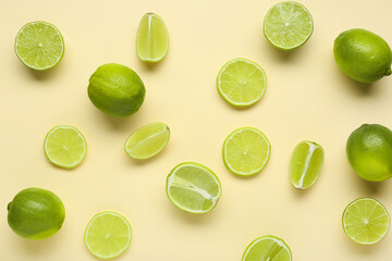 Wall Mural - Fresh ripe limes on beige background