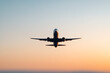 © A2Z AI  - Airplane Ascending: A stunning view of an airplane taking flight against a vibrant sunset sky.