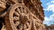 © A2Z AI  - Stone Wheel Detail: Intricate carvings adorn a historical stone wheel, part of an ancient architectural structure, hinting at rich cultural heritage.