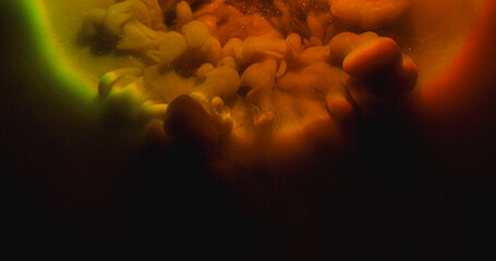 Wall Mural - Paint blend. Color cloud texture. Defocused orange green red splash rainbow vapor glitter water spreading on abstract dark black background.