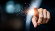 © SS Stock - A close-up of a hand pointing with a spark of light, symbolizing innovation and creativity in technology and digital advancements.