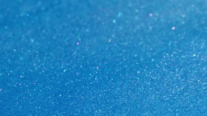 Wall Mural - Wet glitter. Metallic ink. Blue white shimmering pigment wave color flow. Art acrylic shiny particles mix liquid defocused background.