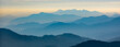 © simohamed - Amazing wild nature view of layer of mountain forest landscape with cloudy sky. Natural green scenery of cloud and mountain slopes background. Maehongson,Thailand. Panorama view