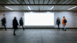 © Daria - People walking past a large blank illuminated advertisement board in an urban underground subway corridor with tiled walls and overhead lighting