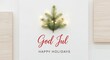© Ayu - Festive Christmas Pine Branch with Fairy Lights and God Jul Text on a White Wooden Background - Holiday Season Greeting Card Concept