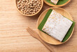 © nungning20 - Top view of tempeh made from fermented soybeans on wooden background, Traditional Indonesian food, Healthy vegan and plant based ingredients