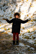 © Zoran Jesic - Boy with snow and autumn leaves enjoying winter