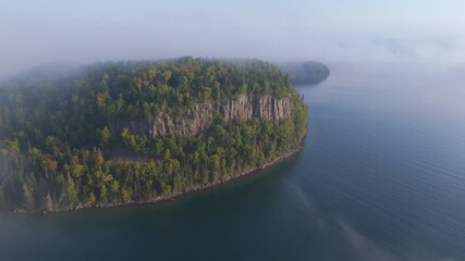 Wall Mural - Aerial view Vertical cliff and forest during early autumn at Lake Superior shoreline in Ontario, Canada.