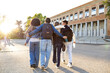 © luisrojasstock - Diverse students walking to university campus together