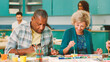 © Monkey Business - Group Of Retired Seniors Attending Art Class In Community Centre With Teacher