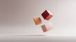 © Olena - Abstract image featuring three levitating cubes in shades of peach, rust and light brown, on a neutral, soft background. Minimalist, elegant,  great for conceptual designs.