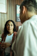 © Marko Geber - Man and a woman having a conversation while on a break from a group therapy session