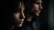 © Bussakon - A woman and man look away from each other near a window their faces reflecting a mood of quiet contemplation and melancholy