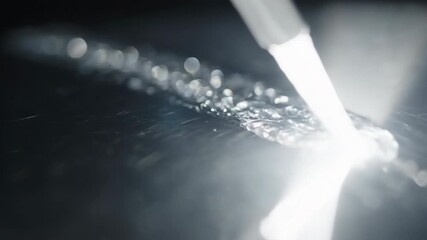 Wall Mural - Abstract slow motion of a focused light source sweeping across a highly polished, metallic surface, generating dazzling, shifting reflections and glints metallic surface, illumination, silver