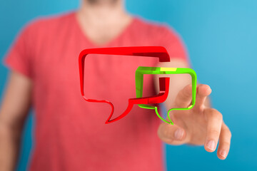 Conceptual representation of dialog and chat. A man presenting communication bubbles for online conversation. Communication is important.