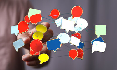 Conceptual image depicting communication network, with hand holding speech bubbles, ideal for technology or business themes