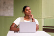 © Austockphoto - indian business woman in office setting with laptop