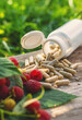 © yanadjan - Raspberry leaf extract and supplements. Selective focus.
