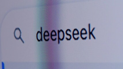 SPAIN, BARCELONA, 28 JANUARY 2025: Man work with deepseek deep seek chat gpt AI online, connecting with AI and using a chat GPT. IT engineer software developer programmer interact with chat bot