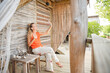 © ADDICTIVE STOCK - Digital nomad woman works remotely from tranquil eco-hotel