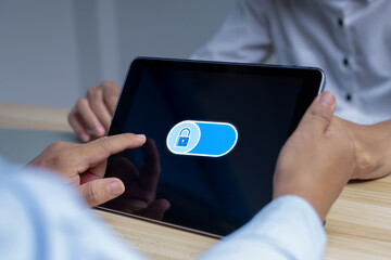 Wall Mural - Lock. business people hand touch on digital lock button on data protection application program with mobile tablet, cybersecurity, backup storage management, internet network technology concept