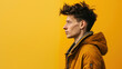 © spyrakot - Stylish Portrait of Young Man in Trendy Jacket Against Vibrant Yellow Background