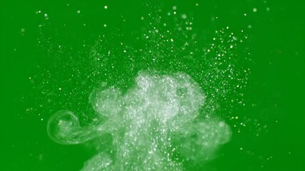 Wall Mural - Brilliant sparkling dust motes slowly drift and softly gather, forming an ambient ethereal cloud on a green screen, revealed in slow motion peaceful, detailed, overlay