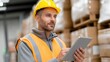 © vlntn - Warehouse Worker Using Tablet for Inventory Management