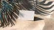 © Алексей Иванченко - Blank white business card mockup on textured sand beach with palm leaf shadows, harsh light, tropical vacation concept, travel tourism branding