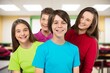 © BillionPhotos.com - Group portrait of school friends posing in classroom
