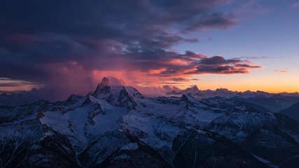 Wall Mural - Epic timelapse of dramatic clouds sweeping over majestic mountain peaks during a breathtaking sunset, highlighting nature's grandeur peaceful, adventure, wilderness