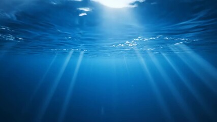 Wall Mural - Seamlessly looping video of deep blue abstract underwater currents with light rays penetrating the surface surface, future, abstract