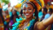 © Apisit - A joyful woman celebrates in a vibrant feathered carnival outfit.