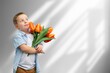 © BillionPhotos.com - Cute happy Child congratulating mom giving flowers.