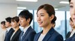 © Stingray_Japan - オフィスで朝礼に整列している日本人女性社員